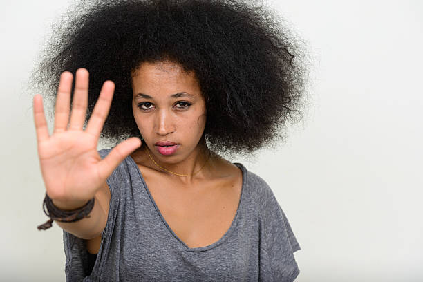 istock African woman showing STOP 543204776