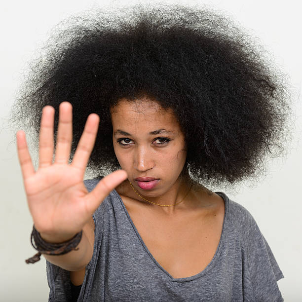 istock African woman showing STOP 543205040