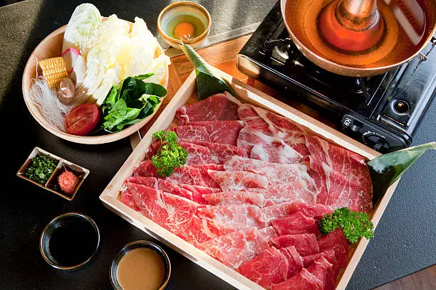 beef slice with vegetable and sauce for shabu in wooden box,Japanese food.
