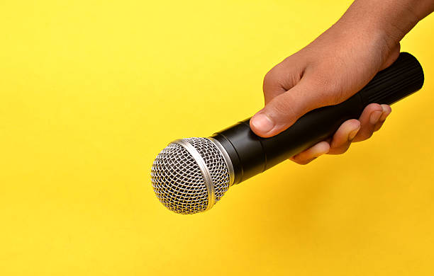 istock Professional holding microphone in hand while giving motivational speach 543205086