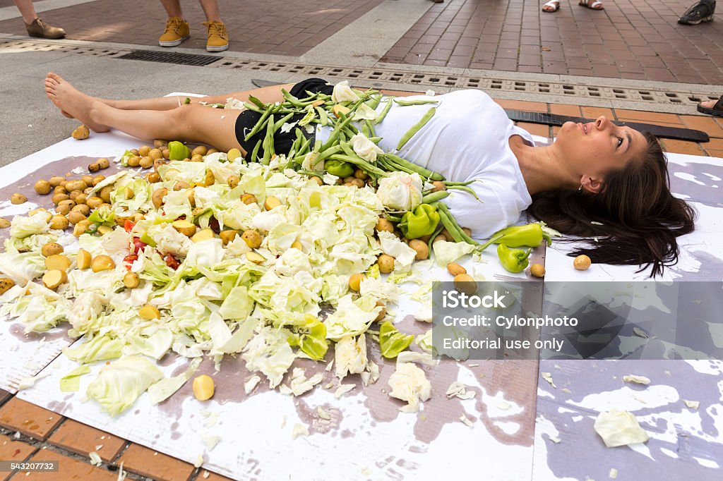 Vegan vegetarian humans cooking protest Sofia, Bulgaria - June 21, 2016: Vegans and vegetarians animal rights activists are cooking humans during a  protes against killing animals for meat or clothing. Activist Stock Photo