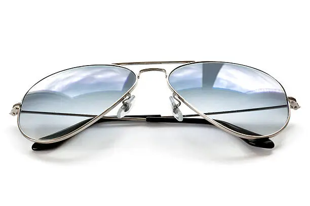 Photo of Blue aviator sunglasses on white