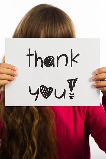 istock Child holding Thank You sign 543207814