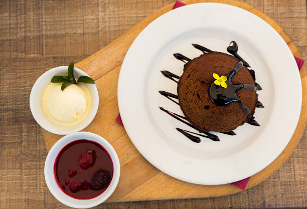Chocolate lava cake with vanilla ice cream and raspberry syrup. Directly above.