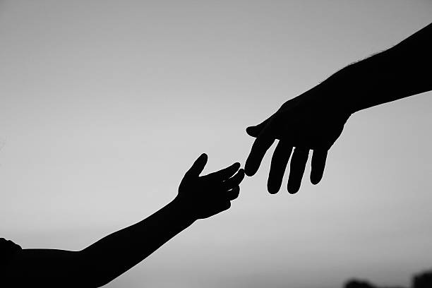 istock silhouette parent and child hands 543212714