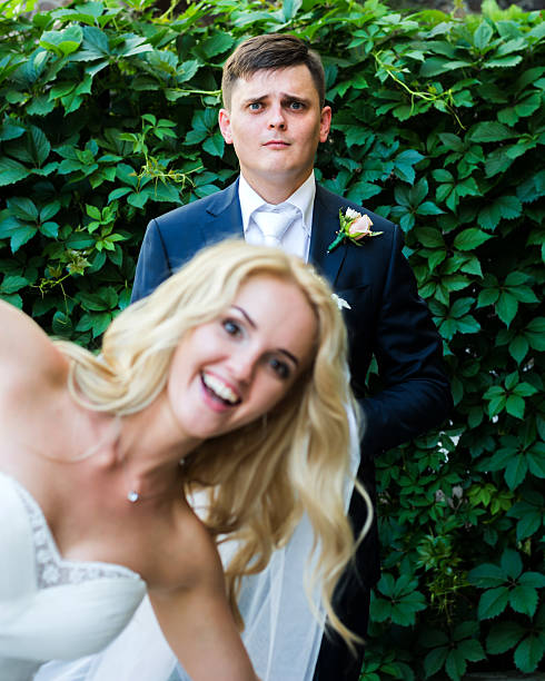 istock the bride and groom having fun in nature 543213902