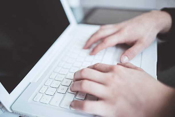 istock Close-up of typing male hands 543214472