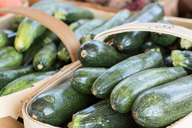 Zucchini In Baskets For Sale At Farmers Market stock photo