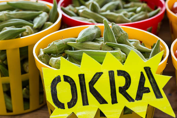 Okra In Baskets At Farmers Market With Sign stock photo