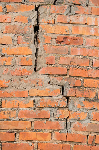 istock texture of a brick wall with a crack 543215496