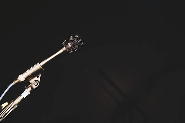 istock Microphones in the darkness 543216012