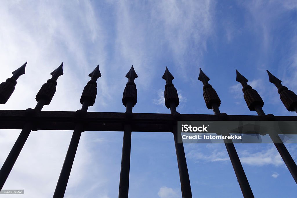 Old iron fence Historical metal fence with spearheads Armed Forces Stock Photo