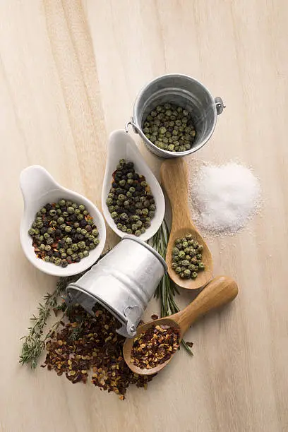 Photo of Condiments on wood background