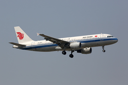 Beijing, China - May 21, 2016: An Air China Airbus A320 with the registration B-6611 approaches Beijing International Airport (PEK) in China. Air China is the flag carrier airline of China based in Beijing.