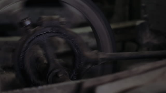 Spinning pulleys and drive wheels in a Rice Milling Machine