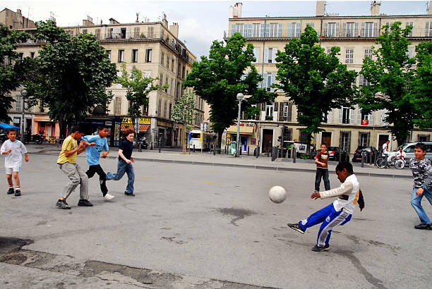 Marseille, France - May 9, 2008: Marseille children play football in Marseille, France. Marseille is France's largest city on the Mediterranean coast and largest commercial port.