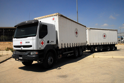 Erez Crossing, Israel - June 22, 2008: A red cross truck delivers provisions to Gaza from Israel at Erez crossing, Israel. The Red Cross has won the Nobel Peace Prize three times 1917, 1944, and 1963.