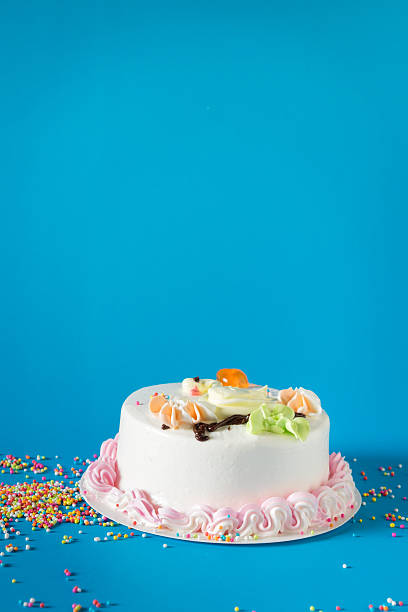 istock Birthday cake with candles on color background 543317446