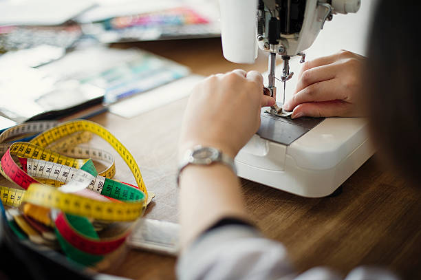 istock Young woman designer preparing a sewing machine 543318518