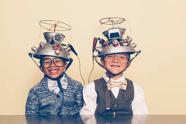 Photo of Two Boys Dressed as Nerds Smiling with Mind Reading Helmets