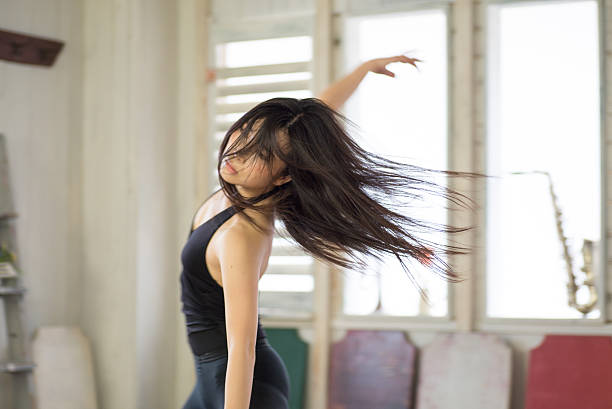 Beautiful Japanese Female Dancer is Practicing Beautiful Japanese Female Dancer is Practicing jazz dancing stock pictures, royalty-free photos & images