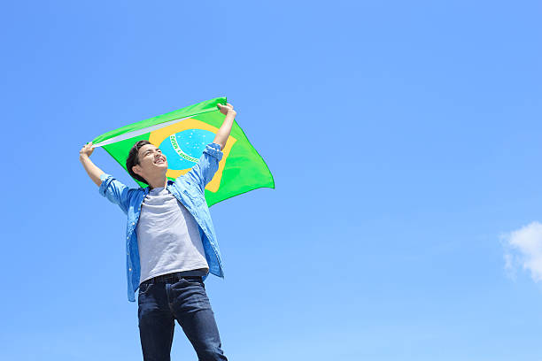 istock Excited man holding brazil flag 543320012