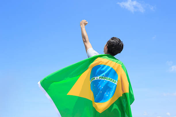 istock Excited man holding brazil flag 543320094