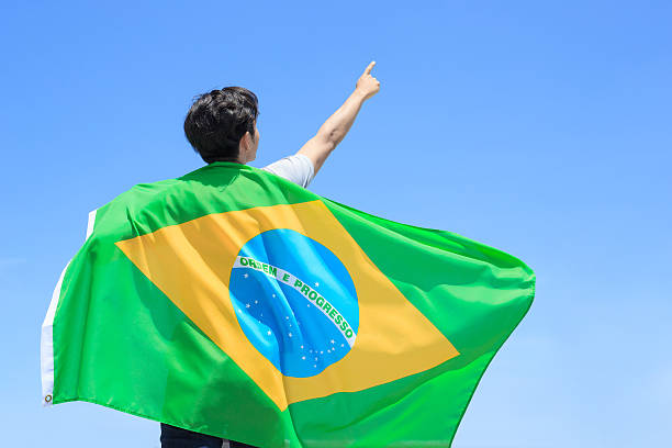 istock Excited man holding brazil flag 543320142