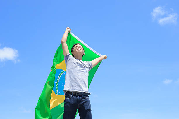 istock Excited man holding brazil flag 543320192