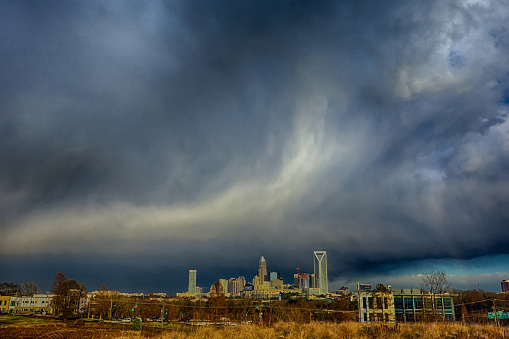 stormy rain clouds over charlotte north carolina skyline