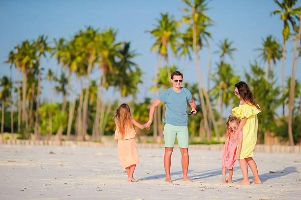 istock Happy beautiful family on white beach having fun 543323248