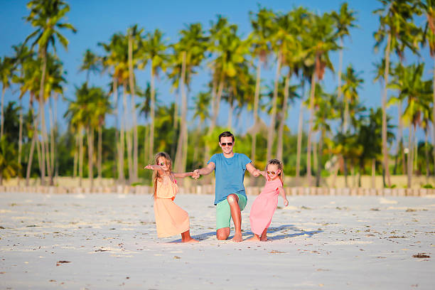 istock Young family enjoying beach summer vacation 543323460