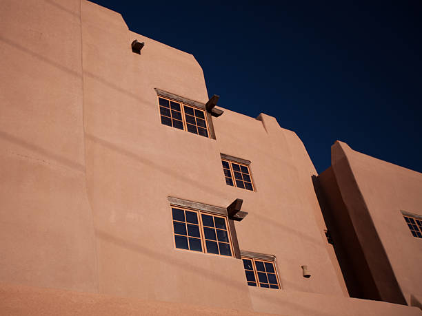 High contrast daylight image of historic adobe building in New Mexico, USA