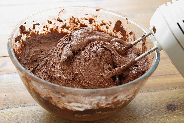 istock Chocolate cake ingredients mixed by an electric whisk 543329470
