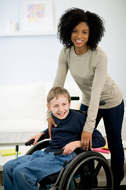 istock Caregiver with a Disabled Child 543330704