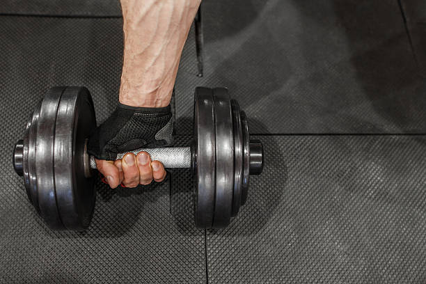 istock Male athlete hand start training with dumbbell 543331050