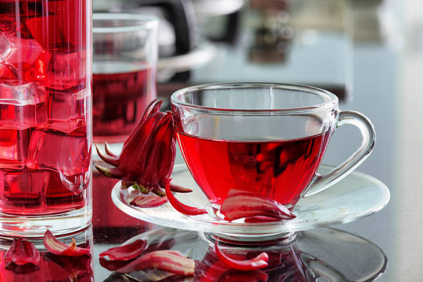 istock Cup of hibiscus tea (rosella, karkade) on kitchen table 543331862