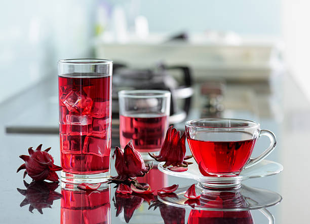 istock Magenta hibiscus tea (karkade, red sorrel) on kitchen table 543332138