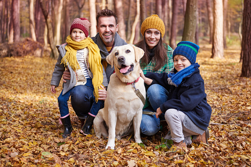 Portrait of happy family during the autumn