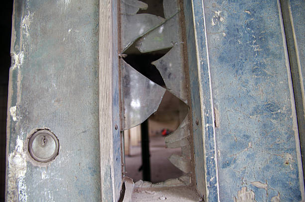 istock Broken glass in old door 543332778