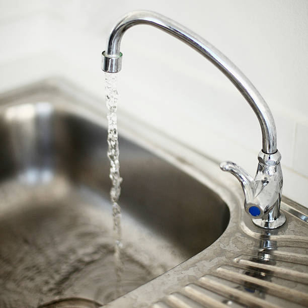 istock open the hydrant of sink to use water 543333240