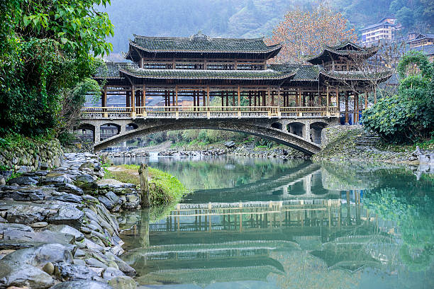 istock wind-and-rain bridge in the Miao village 543333842