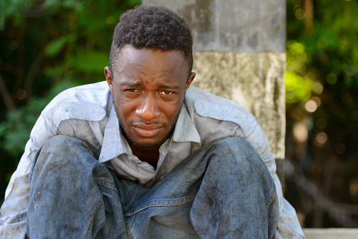Homeless African man outdoors