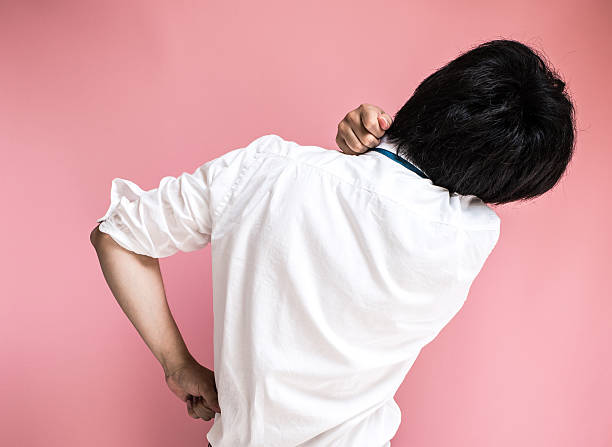 istock Asian man massaging his shoulder 543335056