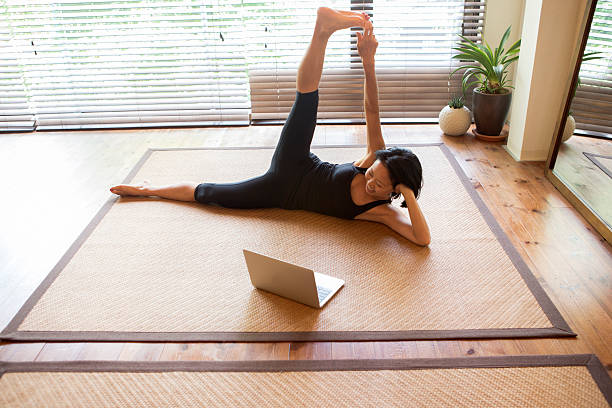 istock japanese female doing physical relaxation exercise with computer  kyoto japan 543337204