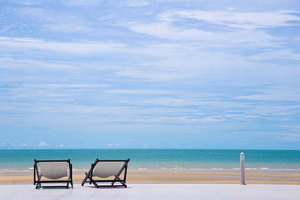 istock Sea Landscape dock platform with two chairs Love concept background 543340472