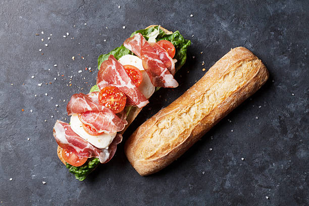 istock Sandwich with salad, prosciutto and mozzarella 543341190