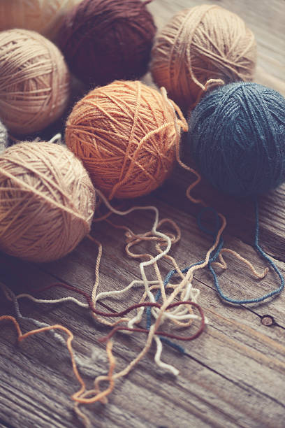 istock balls of wool on a wooden background 543342706