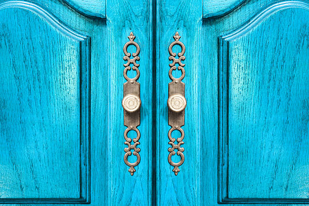 Stylish brass door handles on a cabinet or closet stock photo