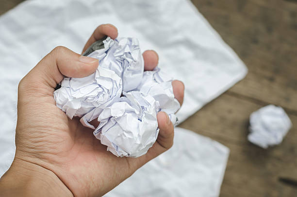 istock Texture of crumpled paper on wood board background 543343230